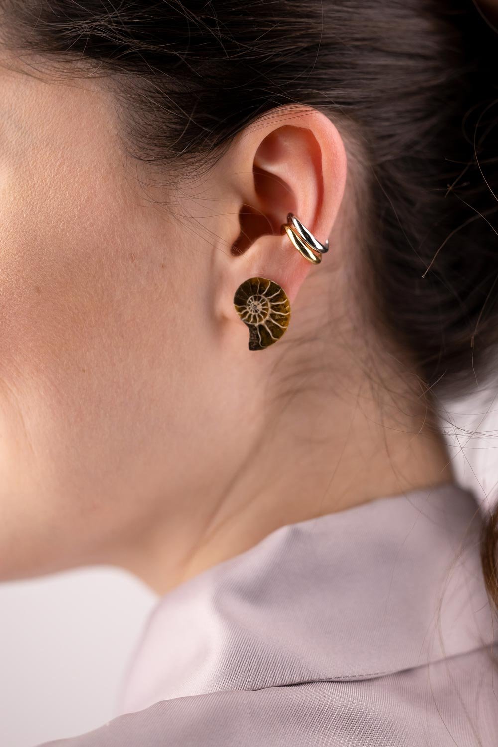 Tiny Ammonite Oana Savu This earrings design is versatile and very easy to wear and match with any outfit. They are a must for every women jewelry box.