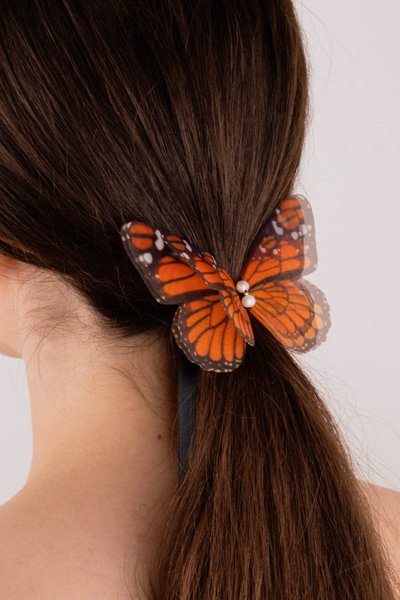 Butterfly Ribbon Tie - Monarch, White Ribbon Oana Savu Handmade ribbon tie accessory is sewn by hand in our little atelier near in Antwerp, Belgium. The voluminous silk butterfly worn around your neck, frames the face, adding a spark of ingenuity to any look. It is sewn on a high-quality silk satin ribbon tie, with a customizable length to fit more styles, worn around your neck - as a choker necklace, style your hair oh hot summer days, around your wrist as a bracelet or even around your waist as a belt for those light summer dresses.