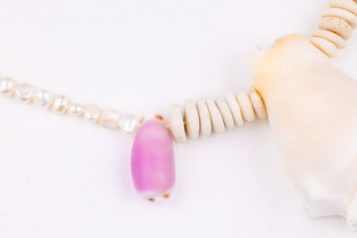 Sea Waves Necklace - Purple Oana Savu Sea shells necklace. This handmade one of a kind necklace has an unique big shell as a center piece, freshwater pearls, 2 special and rare shells and tiny sand dollars which I handpicked from a beach in Knokke Heist Belgium. It has a sterling silver clasp and extension chain. This necklaces collection is perfect for your holiday summer escape.