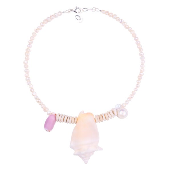 Sea shells necklace. This handmade one of a kind necklace has an unique big shell as a center piece, freshwater pearls, 2 special and rare shells and tiny sand dollars which I handpicked from a beach in Knokke Heist Belgium. It has a sterling silver clasp and extension chain. This necklaces collection is perfect for your summer escape.