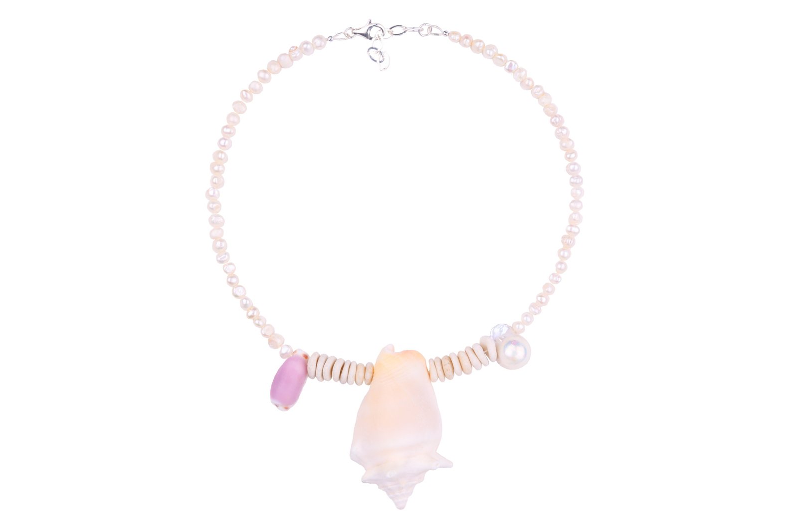 Sea Waves Necklace - Purple Oana Savu Sea shells necklace. This handmade one of a kind necklace has an unique big shell as a center piece, freshwater pearls, 2 special and rare shells and tiny sand dollars which I handpicked from a beach in Knokke Heist Belgium. It has a sterling silver clasp and extension chain. This necklaces collection is perfect for your summer escape.