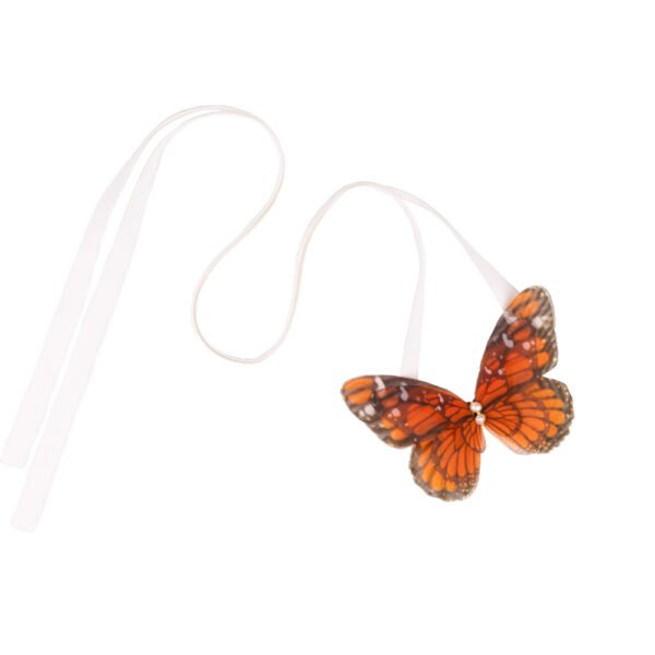 Shop Oana Savu Handmade ribbon tie accessory is sewn by hand in our little atelier near in Antwerp, Belgium. The voluminous silk butterfly worn around your neck, frames the face, adding a spark of ingenuity to any look. It is sewn on a high-quality silk satin ribbon tie, with a customizable length to fit more styles, worn around your neck - as a choker necklace, style your hair oh hot summer days, around your wrist as a bracelet or even around your waist as a belt for those light summer dresses.