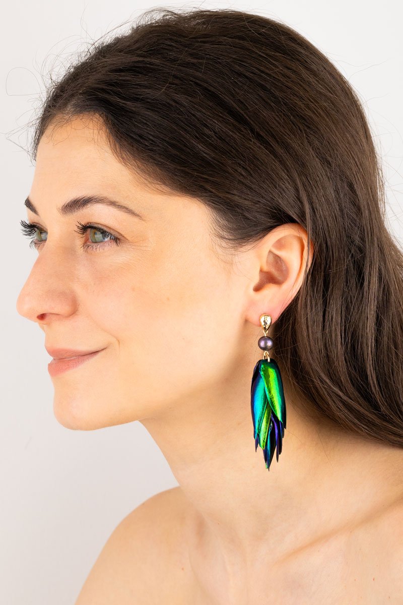 Beetle Earrings Drop Ear Studs- Peacock Pearls Oana Savu Close-up of peacock pearl beetle wings earrings showing colorful reflections